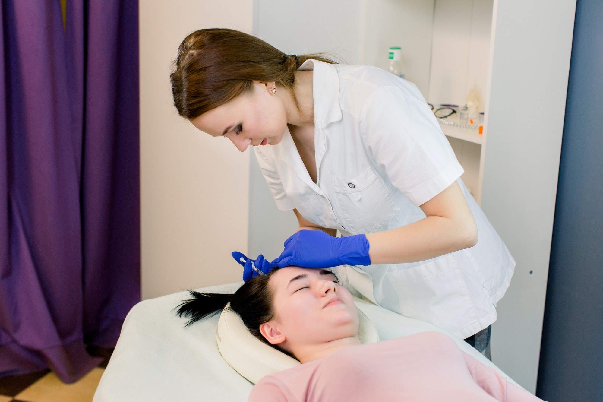 Hair beauty, mesotherapy: a beautician trichologist doctor. Needle mesotherapy. Cosmetic been