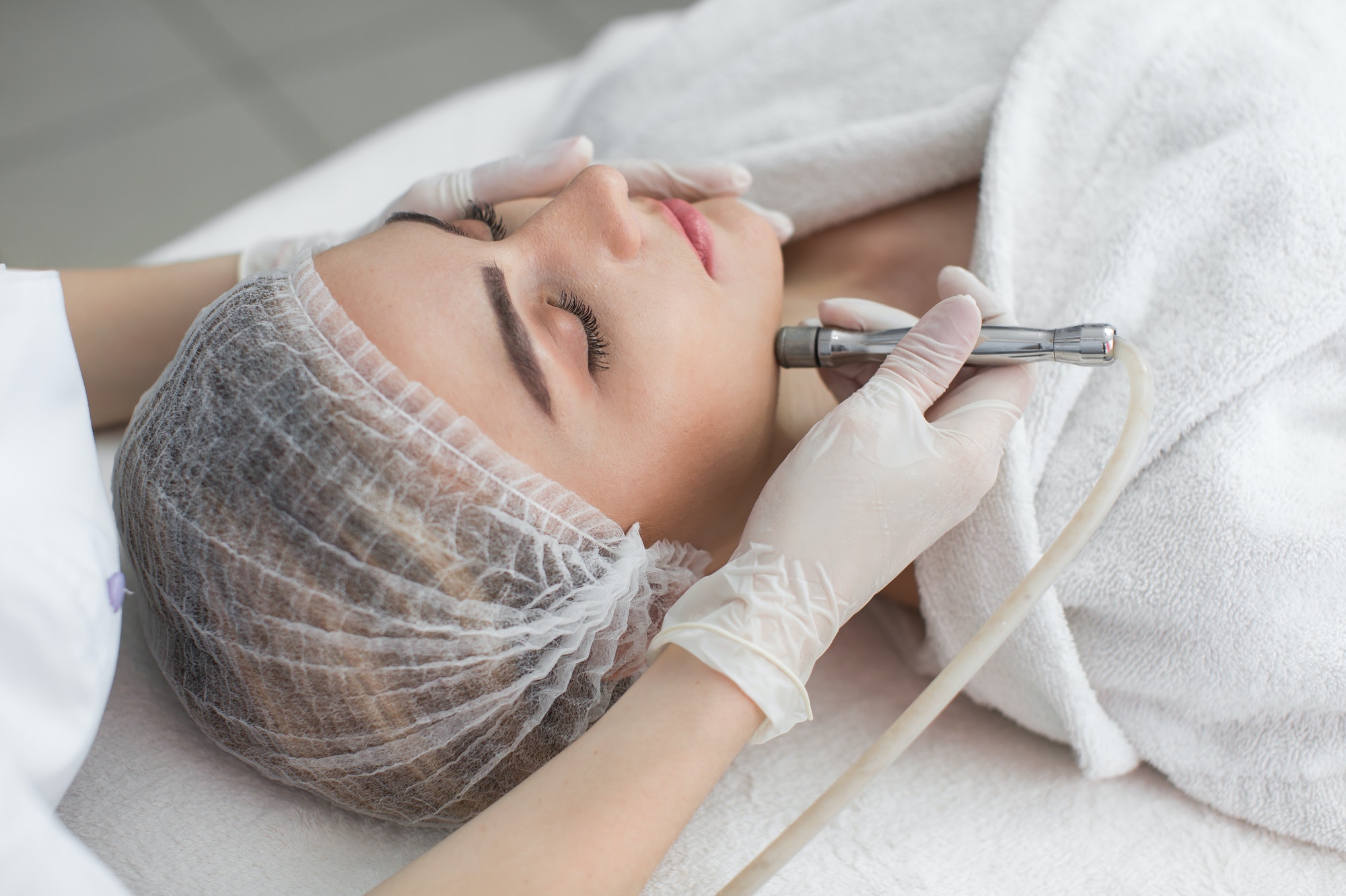 Face Skin Care. Close-up Of Woman Getting Facial Hydro Microdermabrasion Peeling Treatment At